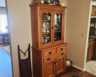 Old sled and antique cabinet filled with goodies, Fenton, etc.