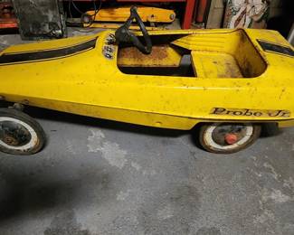 VINTAGE AMF PROBE JR PEDAL CAR AS FOUND IN GARAGE.