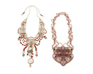 1096
Barbara Natoli Witt & Theodora Euston: Two Macramé Necklaces
Two works:
A Barbara Natoli Witt ornate Cavandoli knotted necklace with various stone beads and ornaments, worked in beige and white cord with carved bone, coral, 22k gold, and silver beads in swags and dangles, with figural motifs, circa 2003, signed and dated to ceramic bead
33 in. x 7 in.
A Theodora Euston "Swan Song" necklace with embroidered and beaded plaque featuring swans, ducks, a butterfly and foliage suspended from elaborate knotwork, all in pinks and lavender, circa 1980, signed and numbered 959
24 in. x 4.75 in.
2 pieces total
223.3 grams gross
Estimate: $600 - $800