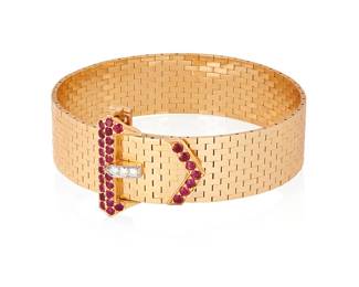 1068
A Retro 14K Gold and Ruby Bracelet
Featuring a buckle motif clasp set with round rubies and diamonds, stamped C+B
Length: 7 3/4 in.
43.2 grams gross
Estimate: $1,500 - $2,500