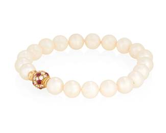 1011
Cartier: An 18K Gold and Cultured Pearl Bracelet
Of a single strand design featuring cultured pearls measuring approximately 7.45 mm, finished with a gold clasp set with round diamonds and round cabochon rubies, signed Cartier
Length: 6 1/2 in.
13.7 grams gross
Estimate: $400 - $600