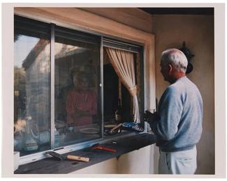 1438
Larry Sultan
1946-2009
"Conversation Through Kitchen Window" from the "Pictures from Home" series, 1986
C-print on paper
Printed in 1999 for the "Mother Jones L.A. Portfolio"
Signed in ink, verso: Larry Sultan
Image: 10.375" H x 12.5" W; Sheet: 10.875" H x 13.875" W
Estimate: $700 - $900