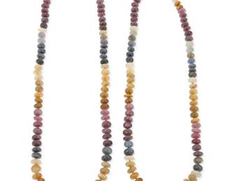 1038
Two 18K Gold and Sapphire Bead Necklaces
Each strand with multicolored graduated sapphire beads and 18k gold toggle clasp
Lengths: 25 in. and 23 in.
216.1 grams gross
Estimate: $1,500 - $2,500