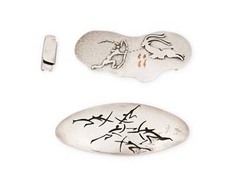 1108
Antonio Pineda: Two Mexican Silver Lascaux-motif Buckles
Antonio Pineda (1919-2009)
Circa 1953-1979; Taxco, Mexico
Each with crown mark for Antonio Pineda; further variously stamped: [Eagle 17] / Hecho en Mexico / Silver / 970 / PZ148 / PZ149
Comprising two Lascaux hunting motif sterling silver belt buckles, one with silver overlay and copper inlay (No. PZ 149) and one with a shadowbox design of multiple figures (No. PZ148), together with one attachment link
3 pieces

Largest: 2 3/8 in. x 5 3/4 in.; smallest: 2 3/4 in. x 5 1/2 in.
285.3 grams gross
Estimate: $400 - $600