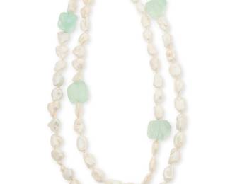1014
An Aquamarine and Cultured Pearl Necklace
Featuring rough aquamarine beads scattered throughout a baroque cultured pearl strand
Length: 52 in.
211.1 grams gross
Estimate: $800 - $1,200
