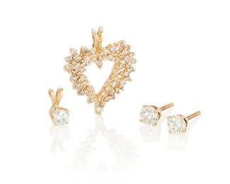 1064
A Group of 14K Gold and Diamond Jewelry
Including a single round diamond pendant weighing approximately 0.30 carat, a pair of round diamond stud earrings weighing approximately .50 carat each, and a heart pendant set with round diamonds weighing approximately 1.00 carat
4 pieces
Pendant: 3/8 in. and 1 in., Earrings: 1/4 in.
4.6 grams gross
Accent diamonds:
Approximate overall color and clarity: H-K, M+ brown, VS-SI
Estimate: $300 - $500