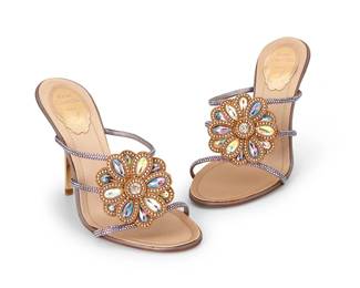 1090
Rene Caovilla: A Pair of Floral Crystal Stiletto Sandals
Circa 2000s; Italy
A pair of glittery lavender crystal-embellished high heeled mules with central diamanté flower, leather soles and gold-toned heel, European size 37.5 / US 7-7.5
Sole: 10 x 3.5 in.; heel: 4 in.
Estimate: $300 - $500