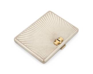 1081
Tiffany & Co.: A Sterling Silver, Gold and Sapphire Cigarette Case
Featuring a sunburst design, centering a yellow gold bow style clasp set with three square-cut sapphires, signed Tiffany & Co., no. 39, Italy with Italian workshop marks
Measures: 4 1/2 x 3 3/8 in.
159.4 grams gross
Estimate: $1,000 - $2,000