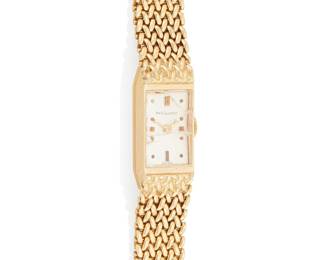 1056
Gilchrist: A Gold Watch
Dial: 8.7mm, rectangular with Diver hour markers
Case: 10.2mm
Closure: 14k woven gold bracelet
Inner circumference: 8 in.
36.2 grams gross
Estimate: $1,000 - $2,000