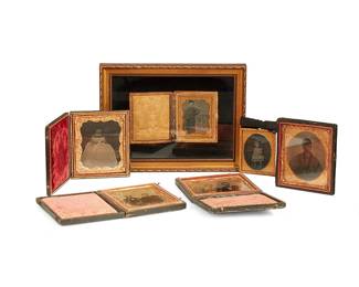1177
19th century
A group of framed daguerreotype portraits
Comprising four daguerreotype portraits in leather bound cases, one daguerreotype portrait in an embossed metal frame with a bow, and one framed daguerreotype portrait in a leather-bound case, 6 pieces
Largest: 6" H x 8" W x 1.5" D; Smallest: 2.5" H x 2" W x 0.25" D
Estimate: $150 - $200