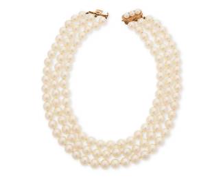 1012
A 14K Gold and Cultured Pearl Necklace
Featuring three nesting strands of cultured pearls measuring approximately 8.60 mm, finished with a gold clasp
Length: 13-14 1/4 in.
117.4 grams gross
Estimate: $1,000 - $2,000