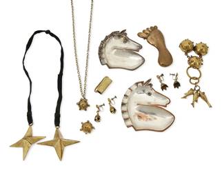 1115
A Large Group of Mexican Mixed Metal Jewelry
Mid/late 20th century
Variously marked for maker and for Mexico
Ten works comprising two pairs of Hubert Harmon delicate brass earrings as well as a Hubert Harmon brass "barefoot" buckle with clasp, a Harmon-style "Sputnik" buckle piece with fish dangles, a brass "sputnik" pendant with second detached charm, and a brass star lariat necklace with black suede strap, together with two Justo "Coco" Castillo mixed metal horse motif dishes with stone set eyes (No. 302)
12 pieces
Dishes: 4 1/4 in. x 4 in.; buckles: 2 1/2 in. x 4 in. & 2 in. x 4 1/2 in.; lariat: 30 in.; earrings: 1 3/8 in.
393.8 grams gross
Estimate: $100 - $200