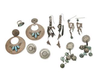 1113
A Group of Silver and Turquoise Jewelry
Late 20th century
Four variously marked for maker and for sterling
Comprising five pairs of earring including a large pair of Nasiho hammered sterling silver disc earrings with set turquoise, a large pair of Replica Athenes Bijoux silver disc earrings with turquoise and silver bead dangles, a pair of sterling silver disc earrings, two pairs of silver brutalist-style long dangle earrings, one pair with turquoise and one with shell and chain dangles, as well as a KB (possibly Keyonnie Begay, Diné) modernist style sterling silver and turquoise ring, 11 pieces
Largest earrings: 4 1/4 in. H x 3 1/8 in. W; smallest: 1 5/8 in. Dia.; ring size: 8
200.2 grams gross
Estimate: $400 - $600