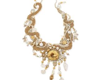1099
Barbara Natoli Witt: A Cavandoli Macramé Gold and Pearl Necklace
Designed with elaborate white, metallic gold and silver cord knotwork featuring a 21k gold foil Bactrian-style serpent ornament and ancient Persian 18k gold foil paillettes, suspending multiple graduated drops with old Japanese Biwa pearls and gold-plated bead and pearl swags, circa 2002, signed and dated to ceramic bead
34 in. x 7.5 in.
96.2 grams gross
Estimate: $800 - $1,200