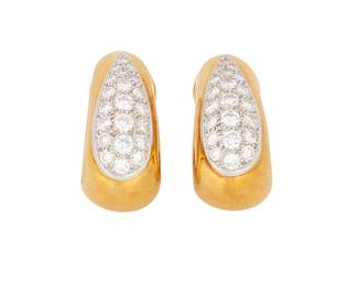 1002
Van Cleef & Arpels: A Pair of 18K Gold and Diamond Earrings
Of a graduated design accented by round diamonds weighing approximately 2.25 carats, signed VCA, no. 425 H-3
2 pieces
Measures: 1 x 1/2 in.
17.6 grams gross
Estimate: $1,000 - $2,000