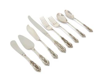 1128
Mid/late 20th century
A Wallace sterling silver "Rosepoint" flatware service
Each marked: Wallace / [stag head cipher] / Sterling
Designed 1934, comprising 8 dinner forks (7"), 8 salad forks (6.375"), 8 teaspoons (6.125"), 8 dinner knives (9.125"), 8 butter spreaders (6.25"), 1 sugar spoon (6.25"), 1 master butter spreader (7"), and 1 cheese server (6.5"), 43 pieces
29.5 oz. troy approximately
Estimate: $500 - $700