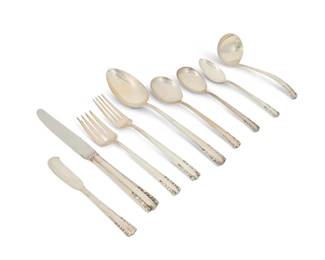 1129
Mid/late 20th century
An Alvin sterling silver "Chapel Bells" flatware service
Each marked: Alvin / Sterling / Pat. 1939 / Chapel Bells
Designed 1939, comprising 6 dinner knives (7.25"), 6 salad forks (6.5"), 6 cream soup spoons (6.375"), 6 teaspoons (6"), 2 tablespoons (8.5"), 6 dinner knives (8.875"), 6 butter spreaders (5.75"), 1 sugar spoon (6"), and 1 gravy ladle (6"), 40 pieces
39 oz. troy approximately
Estimate: $600 - $800