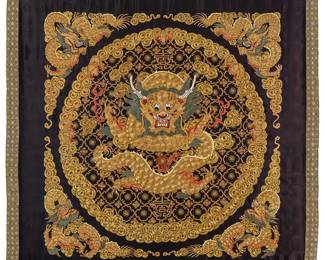 1171
20th century
A framed Chinese silk and gilt thread embroidered dragon panel
The elaborate panel worked in silk and gilt-wrapped thread embroidery in gold, reds, blue, and white, with dimensional padded raised elements, featuring a large central front facing dragon within a roundel surrounded by multiple auspicious symbols including bats, medallions, and stylized floral motifs, and with dragons to each corner, all worked on a black silk backing with narrow brocade border, and professionally mounted to a black fabric backing
35" H x 35" W approximately
Estimate: $200 - $300