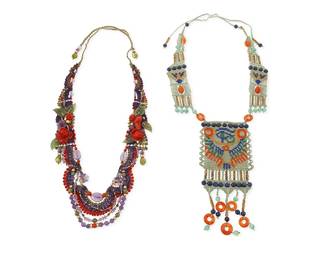 1101
Barbara Natoli Witt: Two Cavandoli Macramé and Hardstone Necklaces
Each signed and dated to ceramic bead
Two works:
An ornate pendant necklace in green, orange, and blue with central stitched plaque with Egyptian motifs and lapis, carnelian, amazonite and brass-toned African beads and dangles, circa 1977
41 in. L x 9 in. H
An ornate necklace with purple, red, and green beaded festoons with multiple swags in amethyst, peridot, coral and nephrite jade beads, with carved coral and jade flowers, circa 2002
43 in. L x 1 1/2 in. H
2 pieces
251.5 grams gross
Estimate: $600 - $800