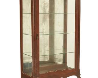 1152
20th century
A Provincial-style wood vitrine
The display cabinet glazed on three sides, including a locking cabinet door with upper floral medallion, revealing three fixed glass shelves and a mirrored back panel, all raised on four legs, the front two carved with foliate motif accents
54.25" H x 30.5" W x 15.25" D
Estimate: $200 - $300