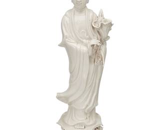 1166
20th century
A Chinese blanc de chine porcelain figure of Guanyin
The robed figure depicted holding a pre-bloom lotus flower, raised on a lotus pad base mounted with flowers
21.75" H x 7.5" W x 6" D
Estimate: $200 - $400
