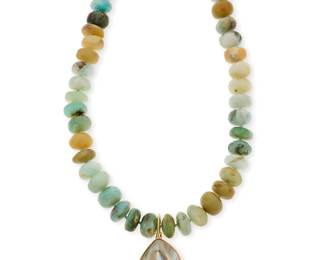 1103
A Gold, Chrysoprase and Shell Necklace
Featuring rondelle style chrysoprase beads measuring approximately 15.00 mm, finished with an 18k gold and shell pendant
Length: 18 in.
112.1 grams gross
Estimate: $800 - $1,200