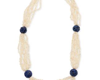 1013
A 14K Gold, Lapis Lazuli and Pearl Necklace
Featuring carved round lapis lazuli beads on a seven strand freshwater pearl necklace, finished with a 14k gold and oval lapis cabochon clasp
Length: 30 in.
136.6 grams gross
Estimate: $400 - $600