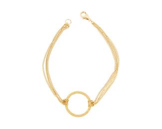 1009
An 18K Gold Bracelet
Centering a textured gold ring suspending multi-chain straps
Length: 7 in.
3.8 grams gross
Estimate: $600 - $800