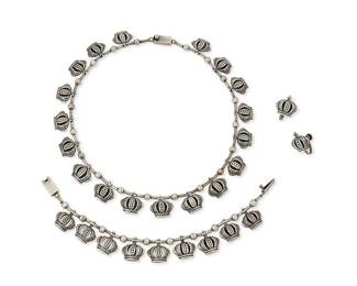 1111
A Set of Mexican Sterling Silver Jewelry
Mid/late 20th century
Two marked: Sterling; earrings marked to post: Silver / Mexico
Three works comprising a delicate sterling silver Margot de Taxco-style bead link necklace with silver crown links, together with a matching bracelet and pair of earrings
4 pieces
Necklace: 15 in. x 5/8 in.; bracelet: 7 in. x 5/8 in.; earrings: 3/4 in.
43.9 grams
Estimate: $200 - $400