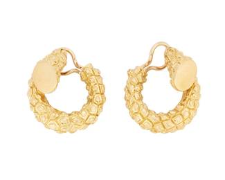 1070
A Pair of Gold Hoops
Of a textured organic design
2 pieces
Measures: 1 in.
19.5 grams gross
Estimate: $1,000 - $2,000