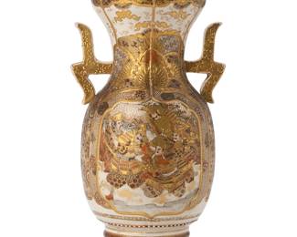 1160
Late 19th/early 20th century
A Japanese Satsuma porcelain vase
Appears unmarked
The heavily gilt and enameled vase with depictions of court scenes on either side surrounded by geometric honeycombed and floral motifs; accented with a flower petaled rim and stylized handles to either side
13" H x 7" Dia.
Estimate: $200 - $400