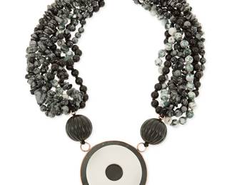 1039
A Beaded Torsade Necklace
A multi-strand collar necklace, with moss agate, snowflake jasper, and black tourmaline beads, with obsidian stone disc pendant and 9k gold setting and clasp, etched SBK to pendant verso
21 in. L x 2.25 in. Dia.
335.1 grams gross
Estimate: $500 - $700