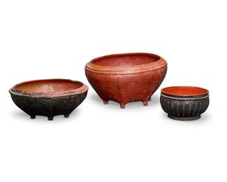 1174
Late 19th/early 20th century
Three Burmese lacquerware baskets
The red and black lacquered vessels, comprising two larger woven basketry vessels raised on feet, and one with vertically indented body above a circular base, 3 pieces
Largest: 10.25" H x 18.5" Dia. approx.; Smallest: 5.5" H x 10" Dia. approx.
Estimate: $300 - $500