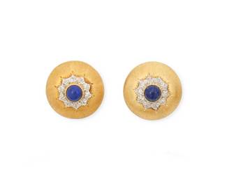 1069
Buccellati: A Pair of Gold and Lapis Lazuli Earrings
Featuring brushed gold in a domed design centering round lapis lazuli cabochon, signed Mario Buccellati
2 pieces
Measures: 3/4 in., 1 1/2 in.
16.7 grams gross
Estimate: $800 - $1,200