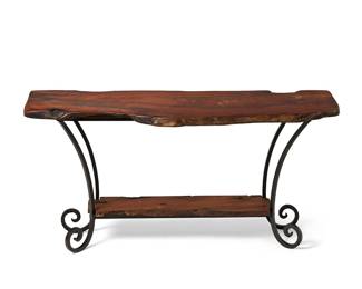 1144
Late 20th/early 21st century
A Spanish-style wood and iron console table
The table with live edge wood tabletop and undershelf supported on a black enameled wrought iron frame with scrolled feet
29.75" H x 60" W x 21.25" D
Estimate: $200 - $300