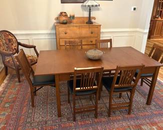 This wonderful table folds down to a very small console. Next photo. Chairs also fold..