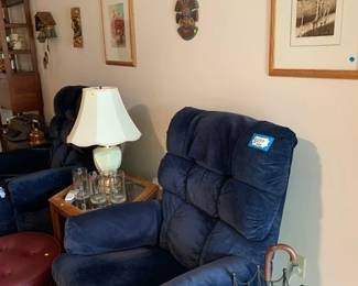 Lazy boy chairs, wall art, lamp, clocks