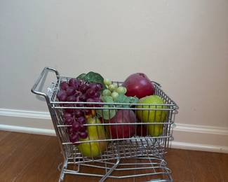mini grocery shopping cart filled with fruits