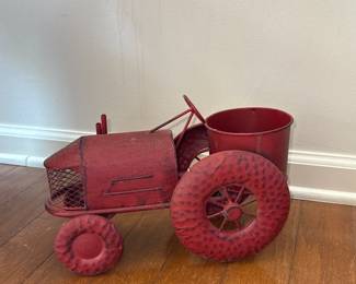 red metal tractor planter