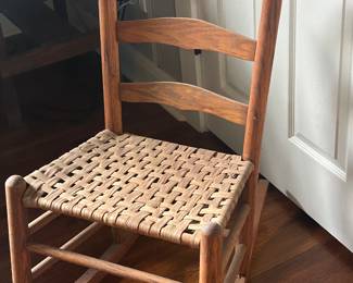 Antique cane bottom rocking chair