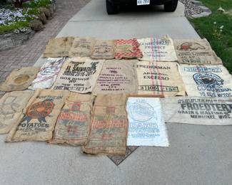 A variety of various bags that delivered fruits, vegetables and grains. NOTE: Laura Corner - the Froedtert grain and malt bag.