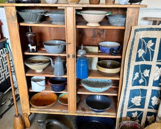 5 shelf unit (no doors) {perfect piece to display in your antique booth or at a flea market} you can see how you can display your great treasures…the campfire coffee pot, the various enamelware, strainers, wood bowls, ceramics. Note: the masher on the left and the rug on the right.