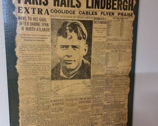 ‘Paris Hails Lindbergh’ for his cross Atlantic trip mounted on a board.