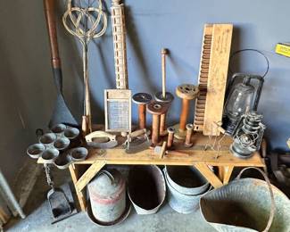 A variety of primitives. A washboard w/ a 'Crystal' glass insert, wood 20 cigar tobacco mold press, upper lft is a Crpet tool, top middle - pasta rolling pin.