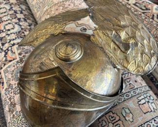 Silk rugs from London and winged hat.