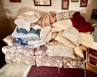 sofa, pillows, blankets