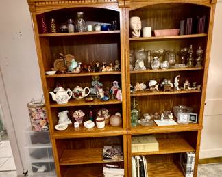 bookshelves, figurines, candles, books