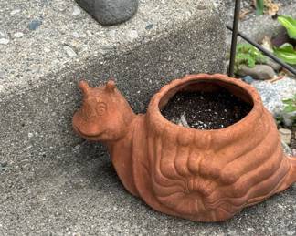 rock (hide key) & snail planter