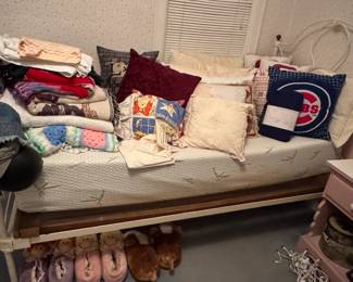 Daybed, bedding, pillows, bedside table
