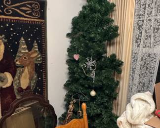tall, skinny Christmas tree with ornaments